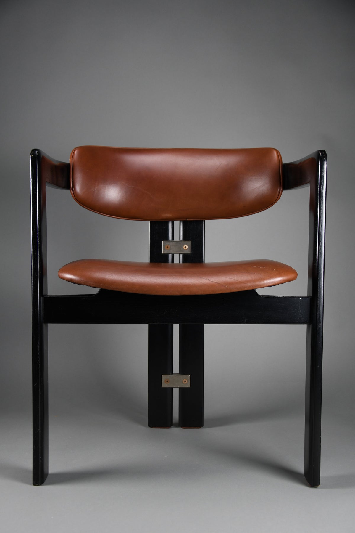 1960s Pamona armchair by Augusto Savini for Pozzi Italy – sculptural black lacquer & cognac leather - Furniture