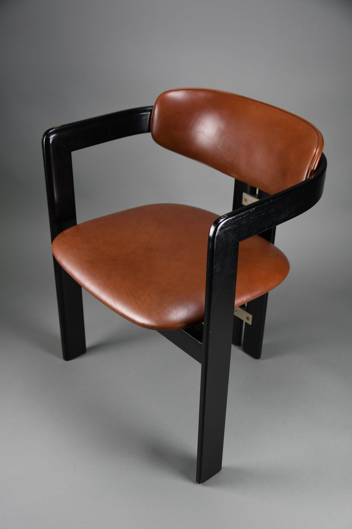 1960s Pamona armchair by Augusto Savini for Pozzi Italy – sculptural black lacquer & cognac leather - Furniture