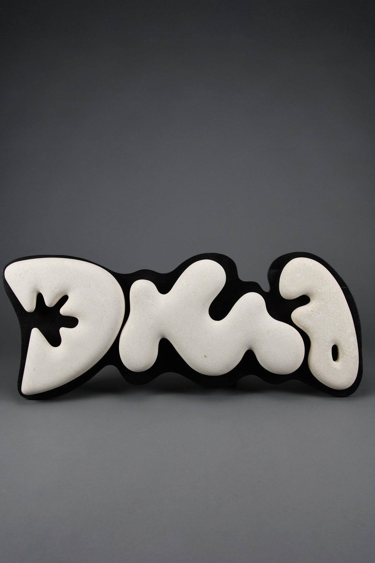 “Murena”: Alberto Cabiddu wall sculpture, 1999, Pietra di Vicenza & Ebonized wood