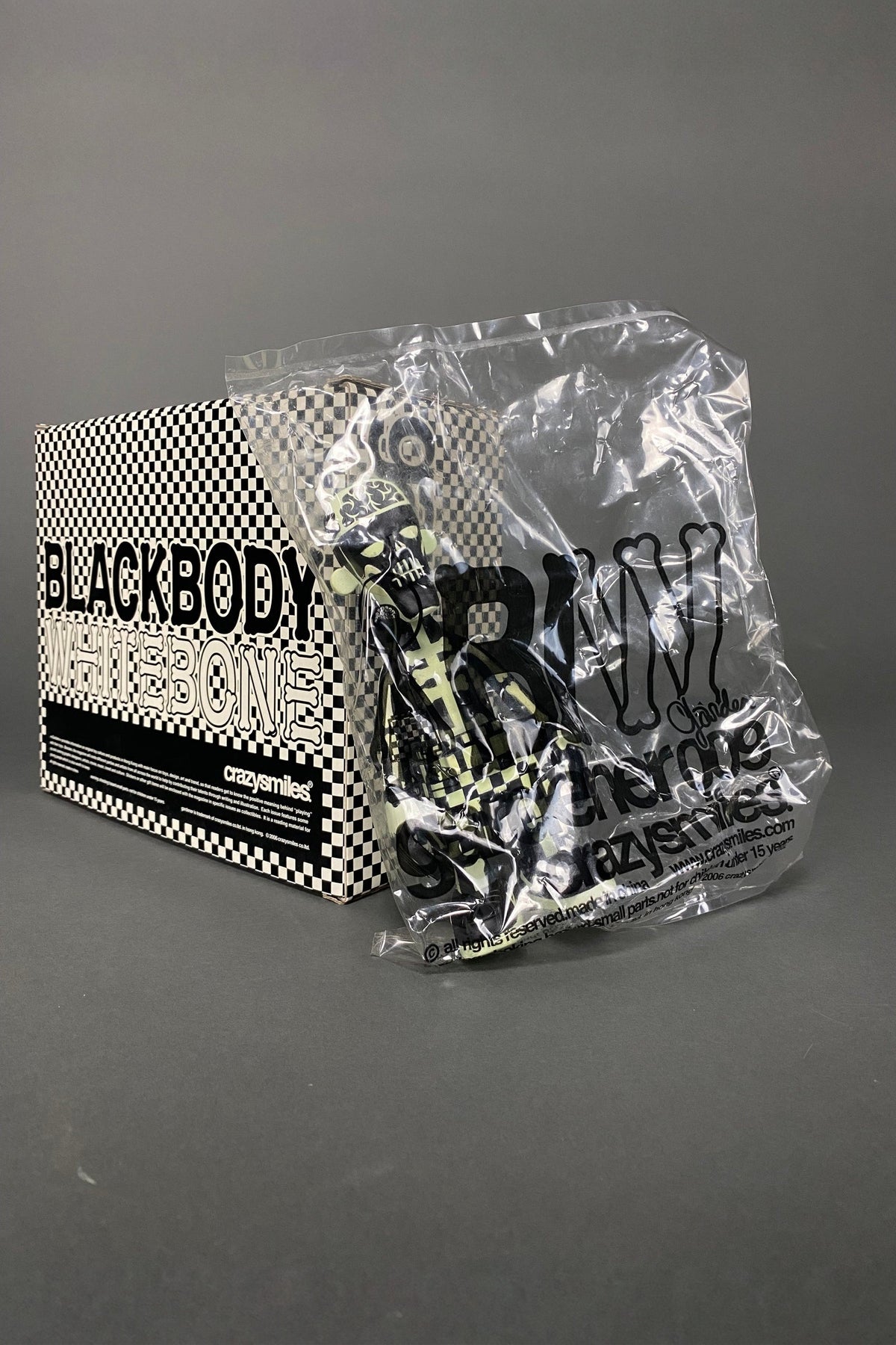 GLOW IN THE DARK BLACK BODY WHITE BONE 2006 DESIGNER TOY BY MICHAEL LAU - Art Toys