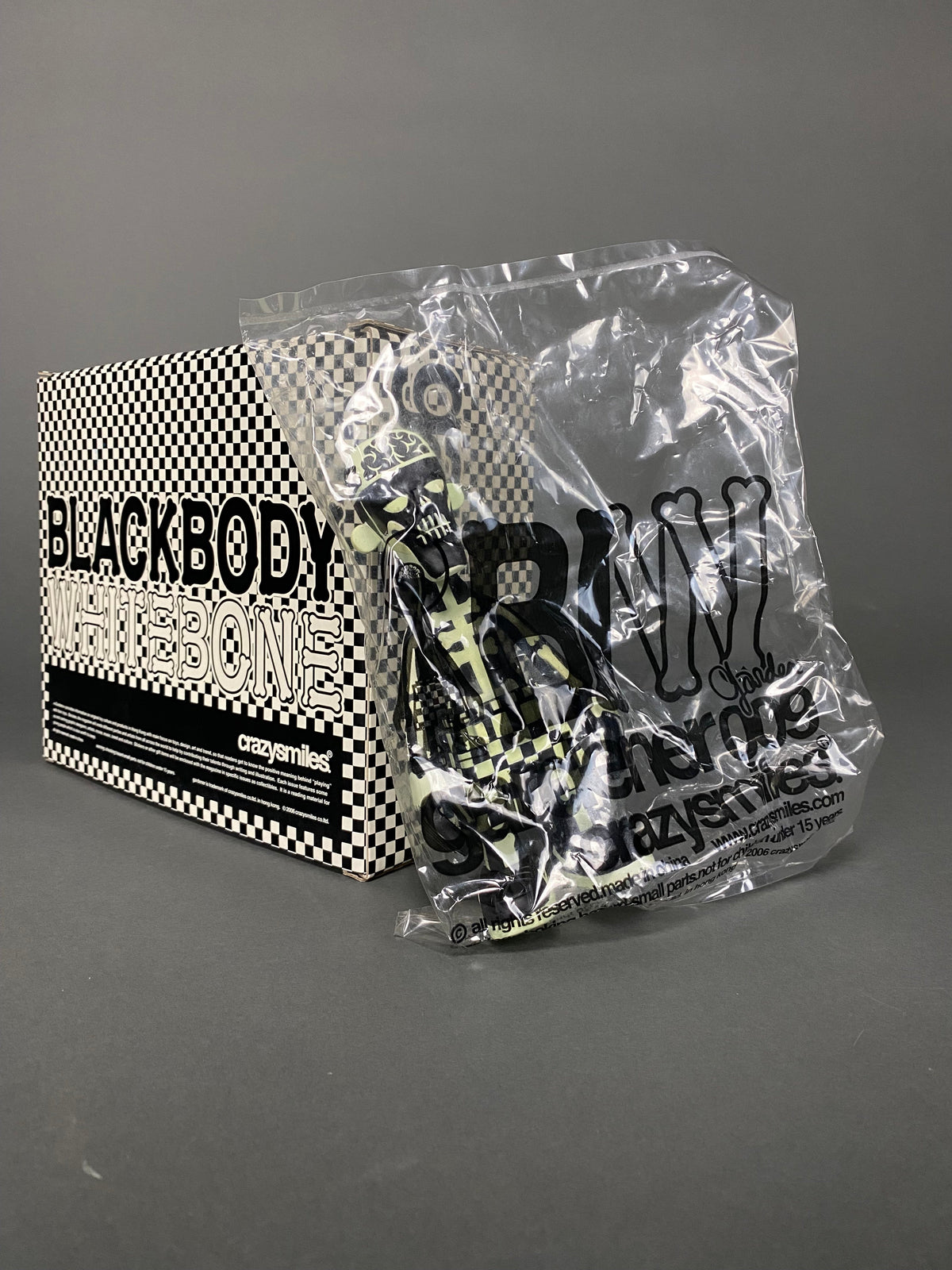 GLOW IN THE DARK BLACK BODY WHITE BONE 2006 DESIGNER TOY BY MICHAEL LAU - Art Toys
